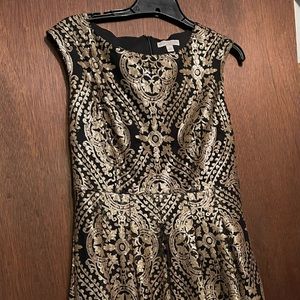 Eva Mendes black and gold sequins dress